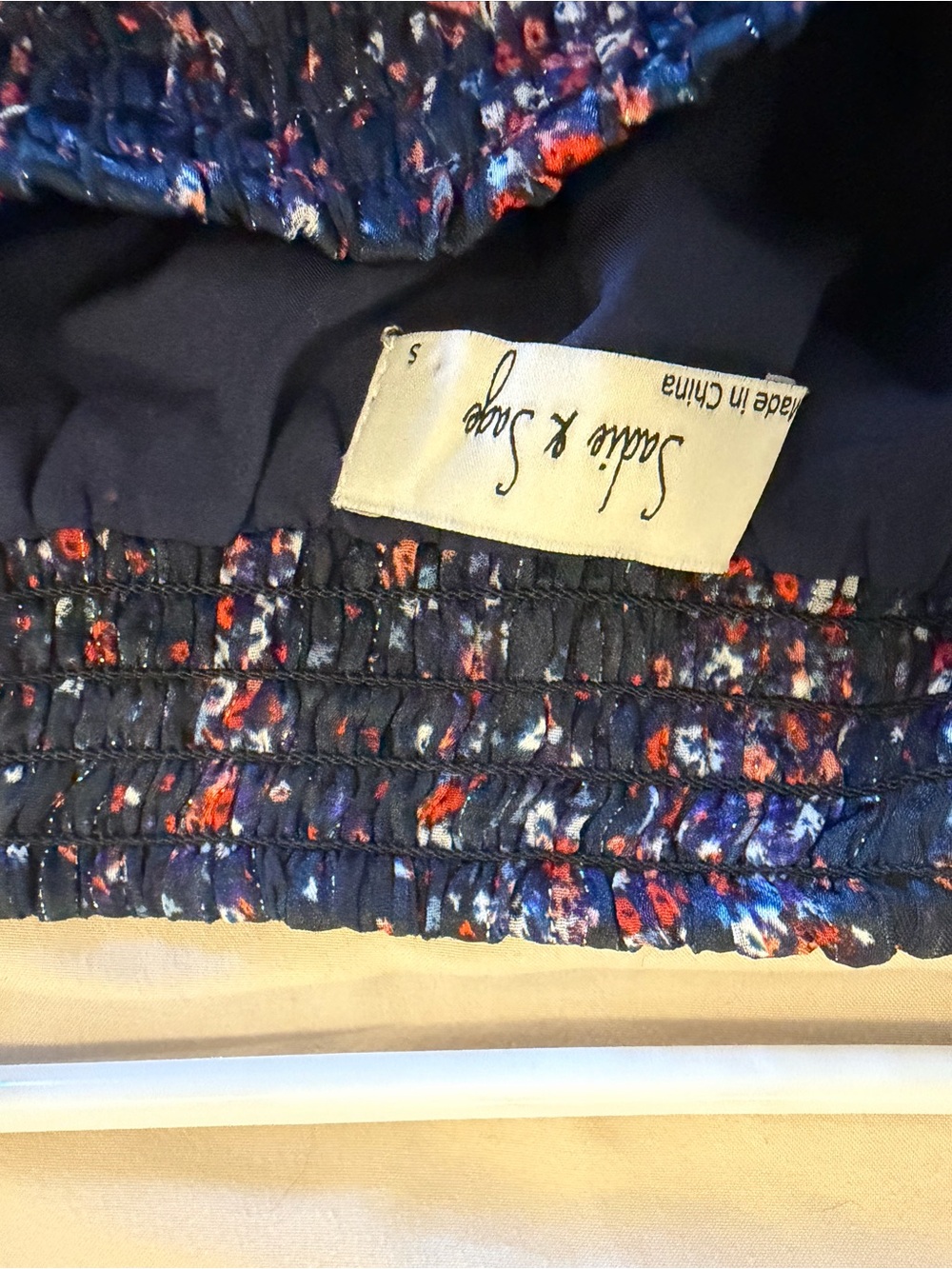 Sadie & Sage Navy Floral jumpsuit with Red and White Details